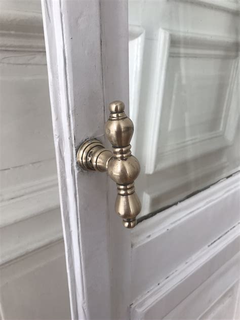 gold door handles white interior vintage design french doors paris vibes rg daily