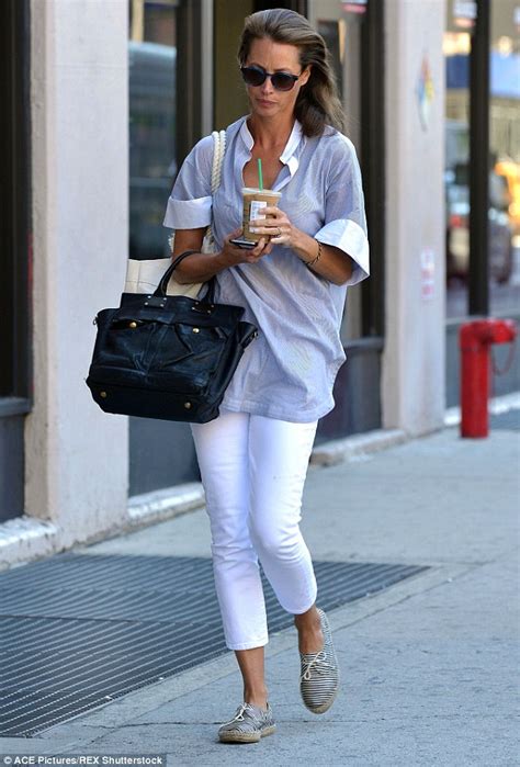 christy turlington shows off in white jeans as she cools off with an iced coffee daily mail online