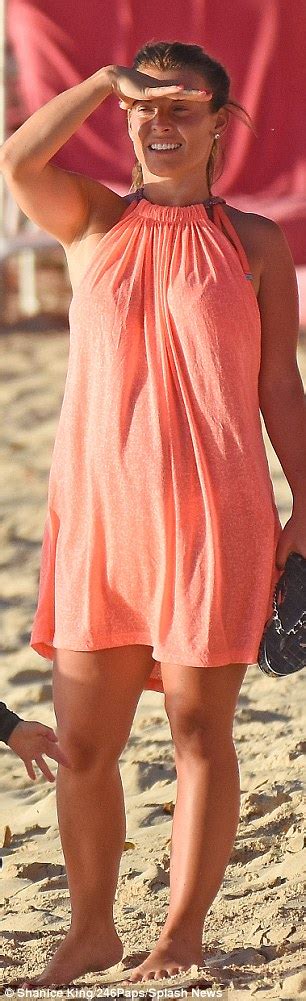 coleen rooney covers up her bikini body in a coral halter