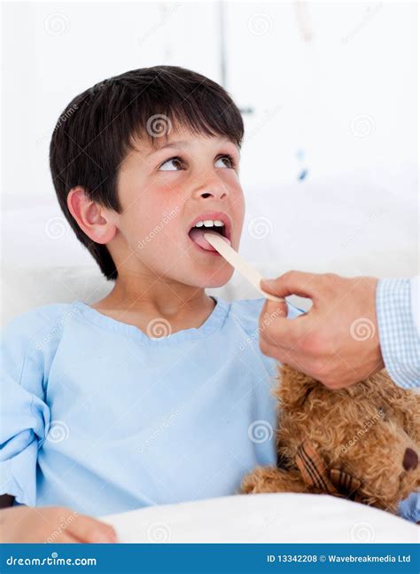 cute  boy attending medical exam stock photo image  patient child