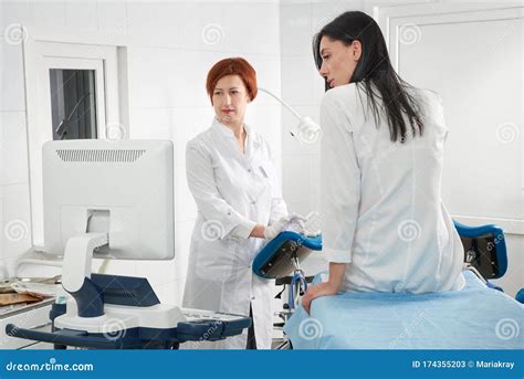 Cropped Panorama Of Gynecologist Examining A Patient Who Is Sitting In