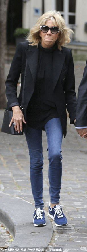 how does macron s wife defy her age fashion jeans outfit winter winter outfits women