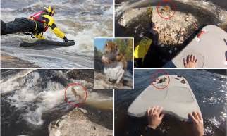 footage shows paddle boarder rescuing stranded squirrel