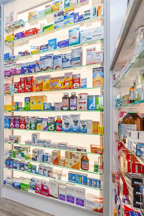 pharmacy shelving design backlit shelves contrast interiors