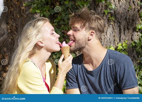 Cute Couple Romantic Dating And Eating Ice Cream Young Pair Sharing