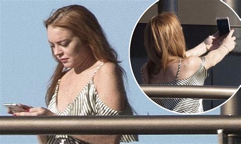 lindsay lohan snaps selfies on a yacht in cannes daily mail online