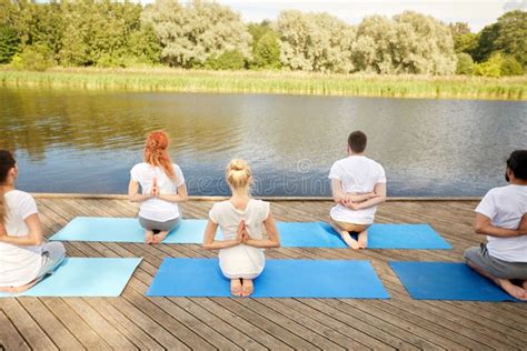 group  people making yoga exercises outdoors stock image image  beautiful recreation