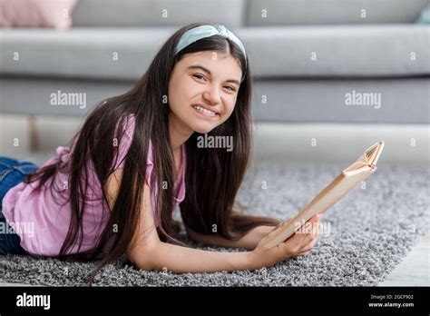 Domestic Hobbies Concept Cheerful Indian Teenage Girl Reading Exciting