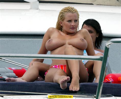 busty michelle marsh sunbathing topless on the beach and yacht