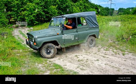 russian jeep uaz   turning  dirt road stock photo alamy