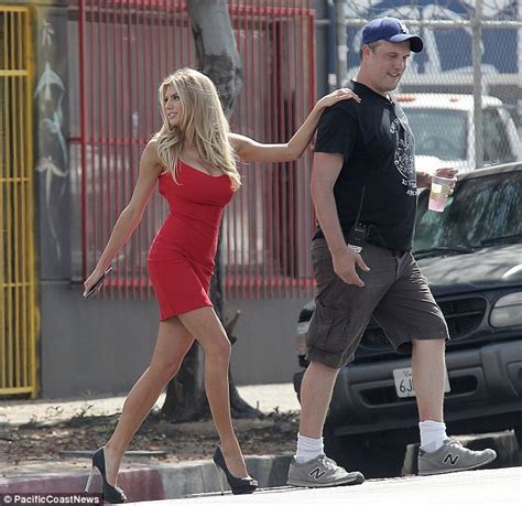 Charlotte Mckinney Flaunts Her Assets In A Tiny Red Mini Dress On Set