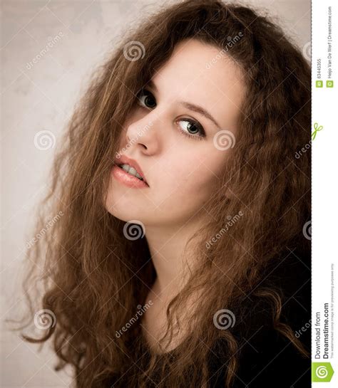 Teenager Woman With Long Curly Ginger Hair Stock Image