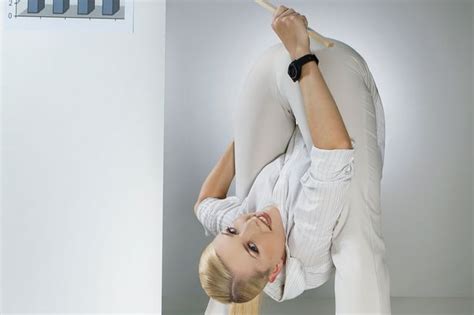 german contortionist bends over backwards for office calendar daily