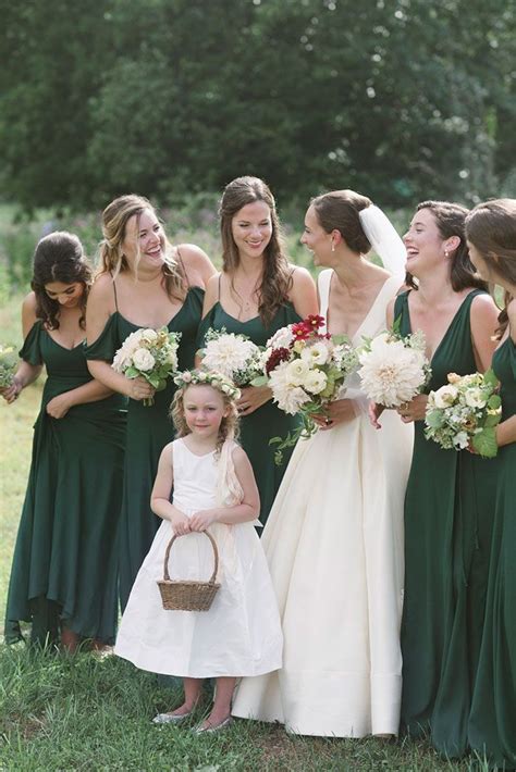 bridesmaids in deep green dresses for an outdoor wedding bridesmaid style green bridesmaid