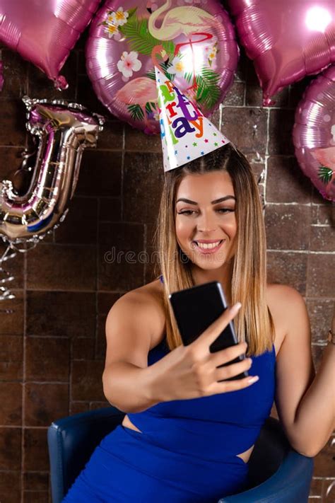 Girl Taking A Selfie And Celebrating A Birthday With A Cap On Head