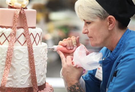 sugar arts designer cake decorator pushes  confectionery skills