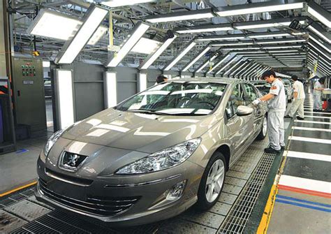 Workers At A Production Line For Dongfeng Peugeot Citroen