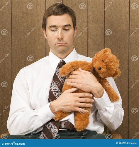 man holding  stuffed animal stock photo image  caucasian person