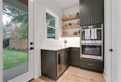 subway tile kitchen backsplash  dark cabinets soul lane