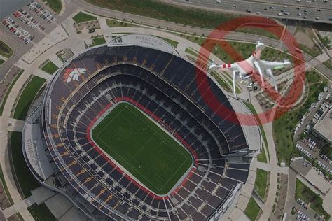 warning fly  camera drone   big sports stadium   jail