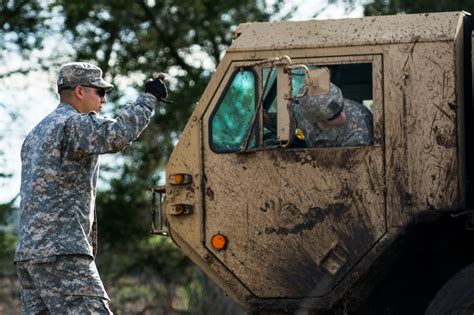 Army Sgt Robert Gonzales Left Helps Guide A Recovery Vehicle To Free