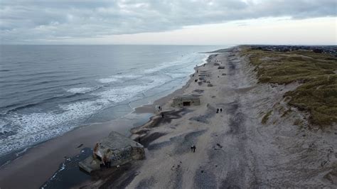 royalty  drone footage klegod ringkobing denmark cloudy ocean beach horizon sunset