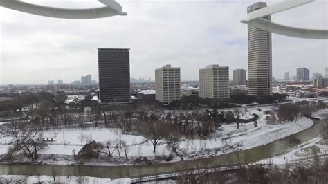 drone footage captures rare snowfall  houston  cold snap