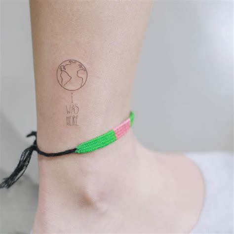 fine line earth tattoo on the ankle