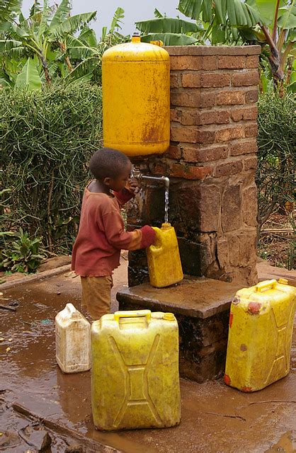 collecting water  beginners jerrycan  action muhura flickr