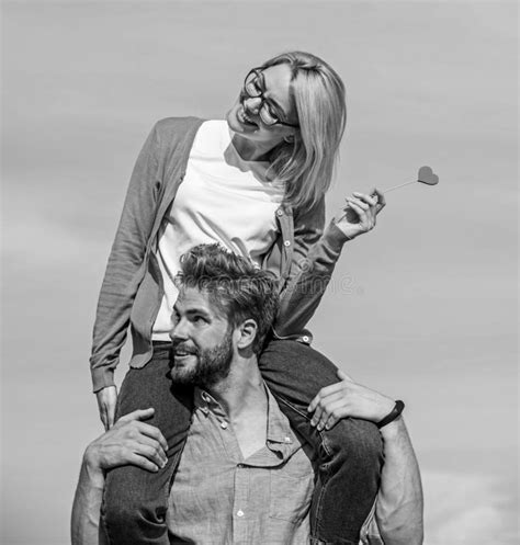 Romantic Date Concept Man Carries Girlfriend On Shoulders Sky