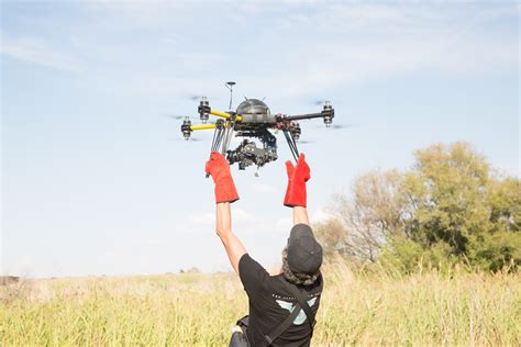cameraman operating  camera drone bold content video production