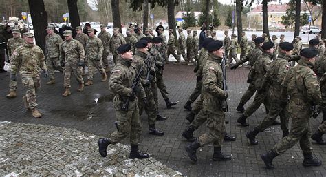 troops roll  poland  largest deployment  cold war