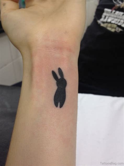 24 small rabbit tattoos on wrist