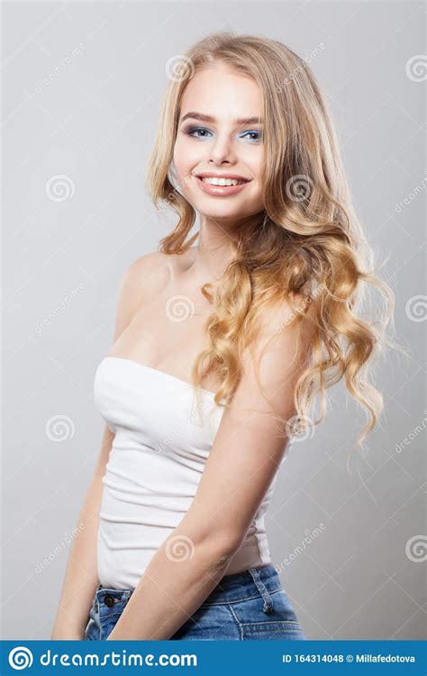 attractive woman smiling pretty girl with cute friendly smile stock