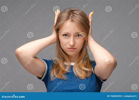 Displeased Blonde Girl Shut Ears With Hands With Annoyed Expression