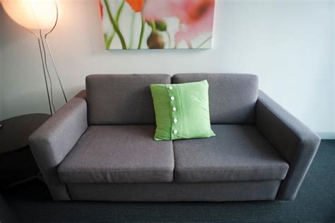 image  upholstered grey settee