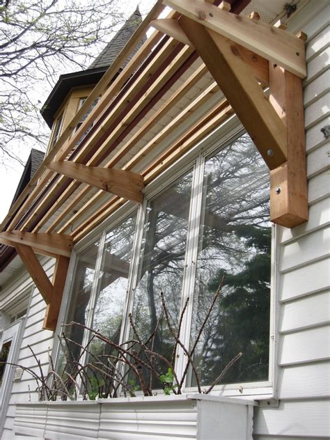 horizontal slat awning  wood house awnings house exterior garden canopy