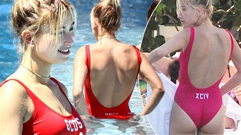 hailey baldwin wears sexy red swimsuit and shows off her peachy bum at