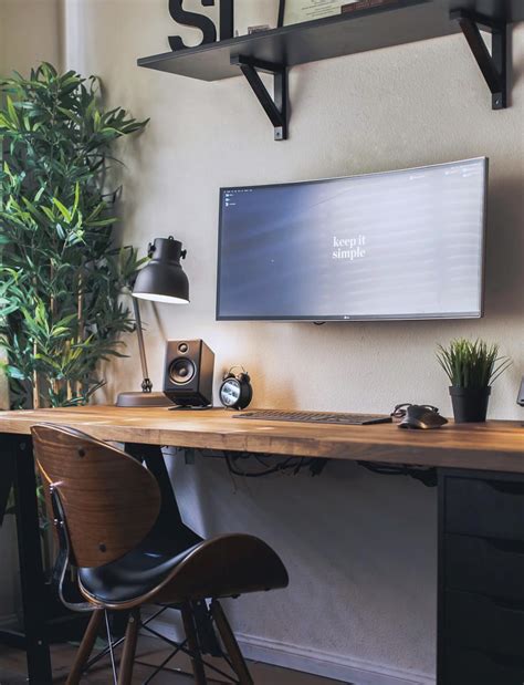 wall mounted monitor helps   space   minimal desks