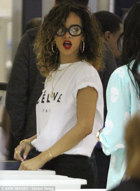 rihanna boards a flight in sexy geek chic daily mail online