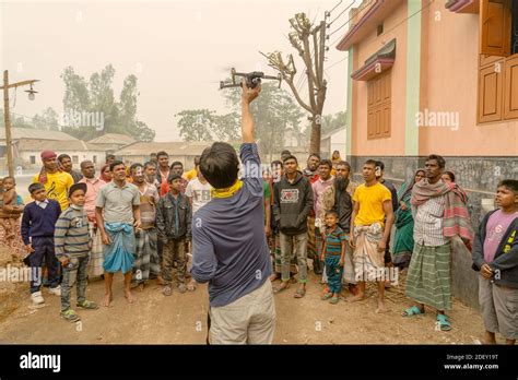 drone landing bangladesh village people standing infront   home watching   landing