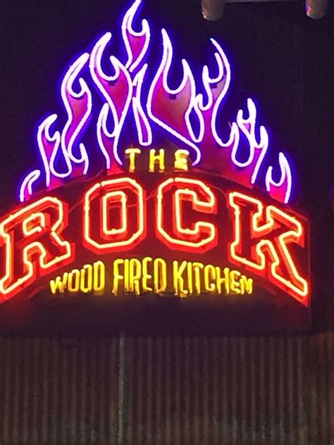 rock wood fired kitchen sign  lit   red  white flames
