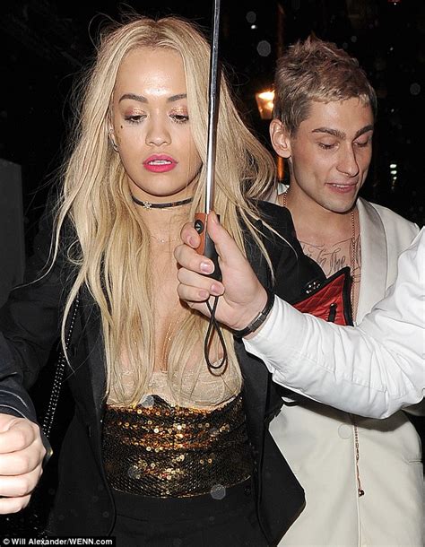 rita ora suffers nip slip in skimpy bra top as she enjoys night out