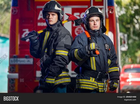photo  firemen axes image photo  trial bigstock