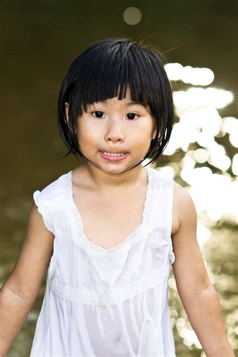 little asian girl wearing wet dress stock image image of teeth water