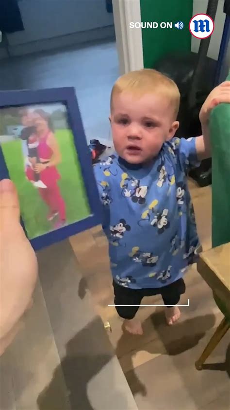 One Year Old Clutches A Picture Of His Mum After She Left The House For