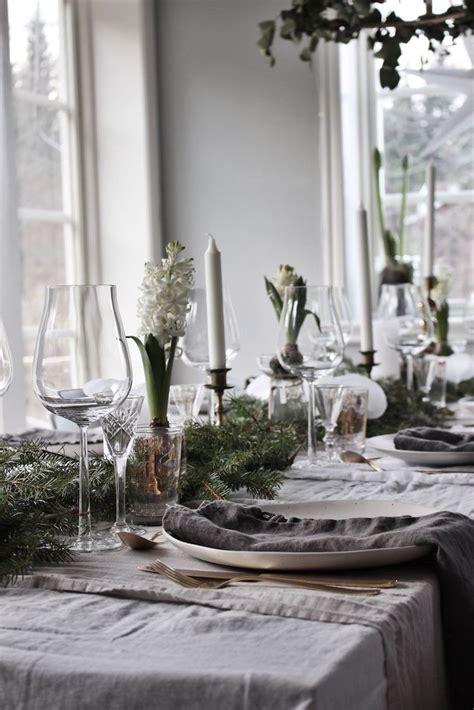 pretty swedish christmas tables with grey linen bras cutlery and hyacinth emily slotte
