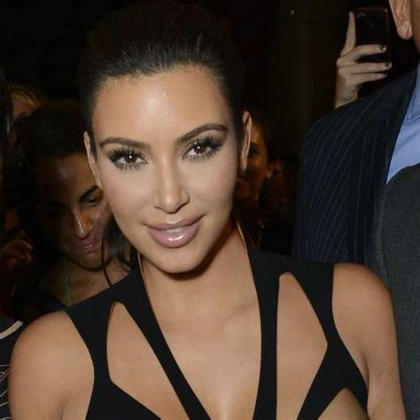 kim kardashian steps out wearing revealing cut out dress