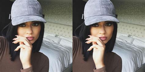 Why Kylie Jenner Always Poses With Her Fingers On Her Lips