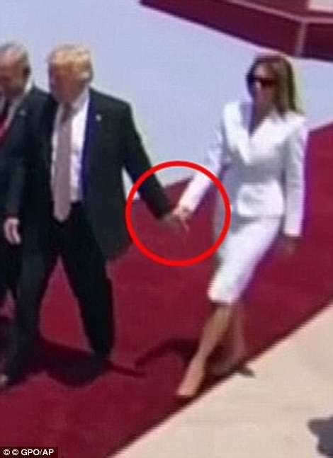 melania trump wriggles fingers away as trump tries to hold